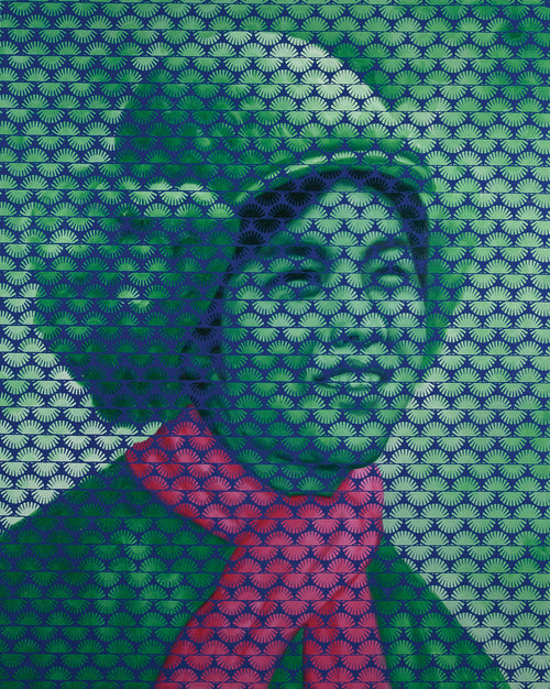 Person wearing a patterned garment with green and blue design
