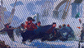 Close-up of a woven fabric with blue and orange patterns